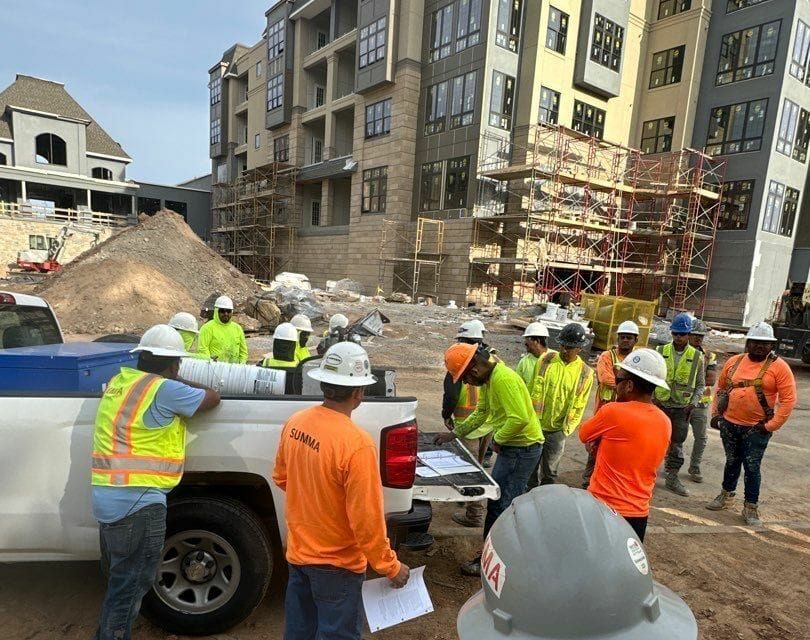 Summa team on site — safety meeting and field coordination